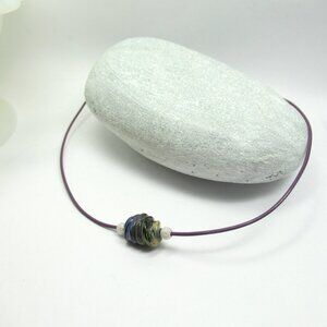 Art glass bead on leather
